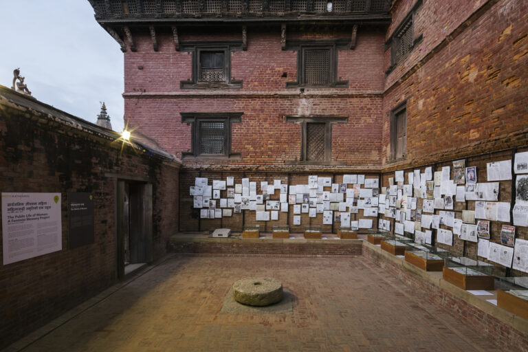 picture of courtyard with papers pinned to the wall